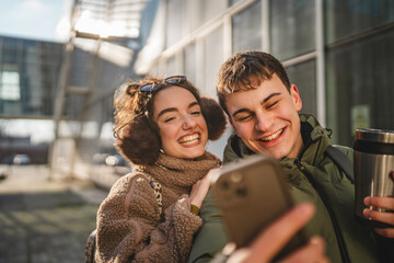 hugged couple take a self portrait or have video call on cellphone