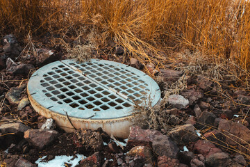 close-up of large drain grate for a retention pond nature stormwater collection background...