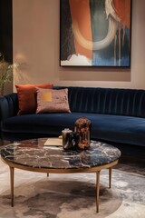 Elegant living room with navy sofa and marble coffee table