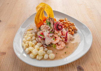 Ceviche mixto traditional Peruvian dish with raw fish, lemon juice, onion,  aji chilli and corn...