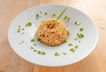 arroz chaufa de pollo traditional Peruvian dish with cooked soy, sautéed in wok onion stalk, chicken, beaten egg, soy sauce, sesame oil