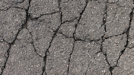 Cracks in specialized road surface. Structured, background image