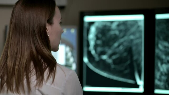 A Medical Professional Carefully Analyzing Mammogram Images for Accurate Diagnosis and Review