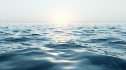 Fototapeta premium Ocean waves gently rolling under a hazy sky at dawn along a tranquil coastline