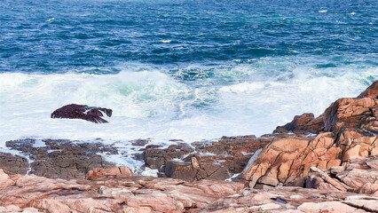 Rugged coastal cliffs with crashing waves in a scenic ocean view