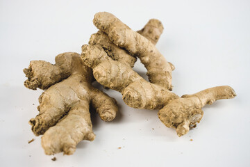 Fresh and Organic Ginger Roots Isolated on a White Background