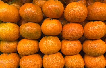  Pile of tangerines on a market stall