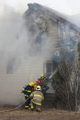 Volunteer Firefighters Training On Live Structure Fire in Saskatchewan