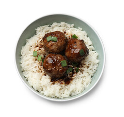 Delicious rice with meatballs, sauce and green onions in bowl isolated on white, top view