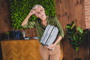 Photo of charming adorable lady dressed shirt hold folder work modern office workplace workstation...