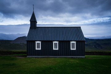 Fototapeta premium The black wooden church of Budir, in Iceland