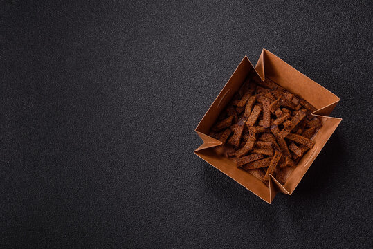 Crispy homemade brown bread crackers or croutons with seeds and grains