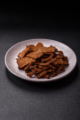 Crispy homemade brown bread crackers or croutons with seeds and grains