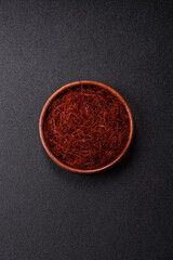 Red thin hot chili threads on a dark background