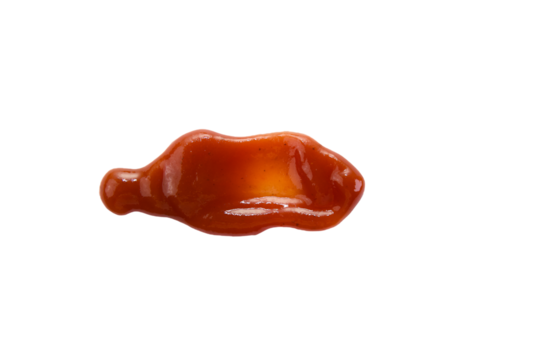 Ketchup dollop on a plain surface