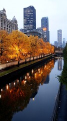 Naklejka premium Cityscape reflection on the river in autumn, with golden trees along the bank.