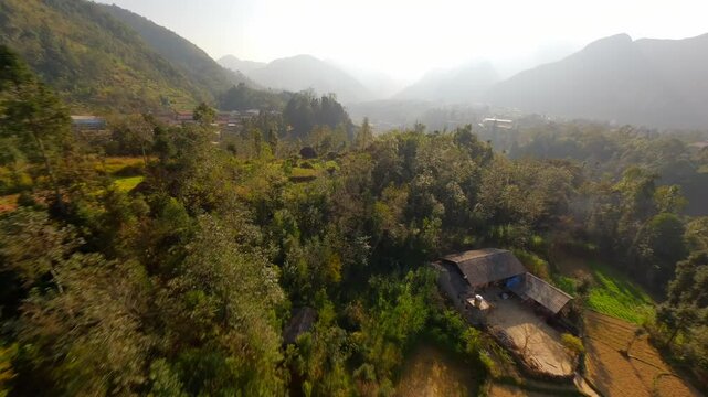 Cinematic FPV flight over picturesque mountain village in North Vietnam