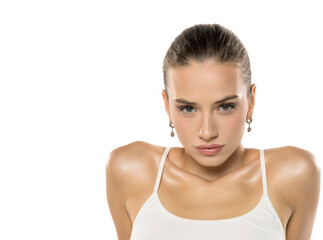 Professional beauty portrait with intense gaze. Model in white top conveys strength and confidence...