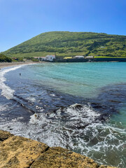 Ocean waves reach the shore of Horta, Faial Island, Azores