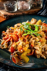 Fried chicken pieces with vegetables.