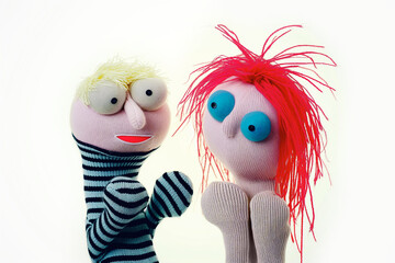 Mise en scene: two funny hand puppets in dialogue with each other