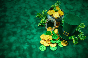 St. Patrick's Day Symbols. A festive setup with a pot of gold, leprechaun hat, horseshoe, and...