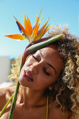 Beautiful curly woman having a home beauty session 