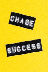 Black label on yellow background with the words CHASE SUCCESS.