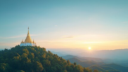 A stunning temple perched on a hilltop against a backdrop of mountains and a colorful sunset sky.