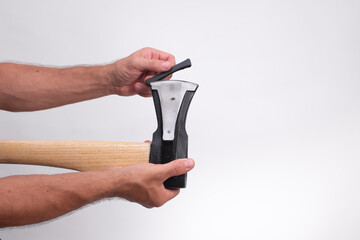 men's hands put a protective case on the axe blade