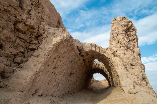 Ruins of tunnels in the ancient adobe fortress wall of Ayaz Kala in Uzbekistan