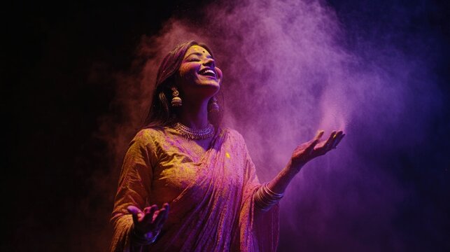 Indian female vocalist in traditional dress performing on stage with colorful smoke and purple light effects.