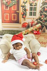 Cute and adorable baby in Christmas decoration. Christmas background. Baby, Christmas holiday.