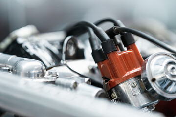 Trollhättan, Sweden - June 28 2024: classic car engine ignition system close-up.