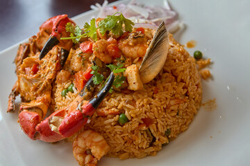 Arroz con Mariscos. A perfect blend of fresh seafood, tender rice, and traditional Peruvian spices that transport you to the heart of the coast. This dish is a true celebration of the ocean's bounty