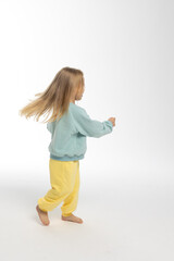 Portrait of beautiful cute little toddler girl. Child with funny face. Pretty smile kid in studio on white background. High quality photo