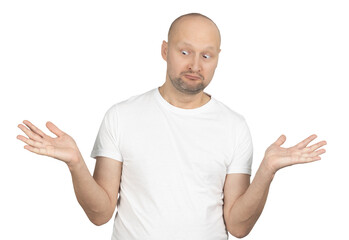 Confused man in white t-shirt shrugging with a puzzled expression
