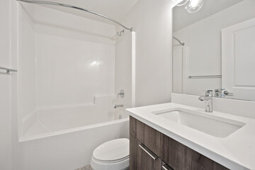 A bathroom with a white toilet and sink