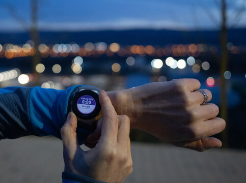 person is setting a garmin watch