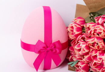A vibrant pink Easter egg with a smooth, glossy surface, set against a neutral or festive background. Perfect for holiday decorations, Easter celebrations, and seasonal designs.