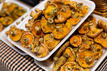 Close up of saffron milk cap mushrooms in plastic packaging