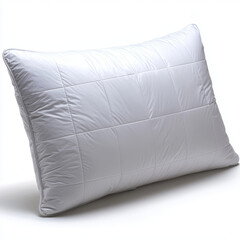 White quilted pillow on a white surface, casting a soft shadow.