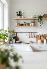 Modern white kitchen interior with wooden shelves, plants and utensils. Scandinavian minimal home design with natural light. Clean cooking space with decorative elements