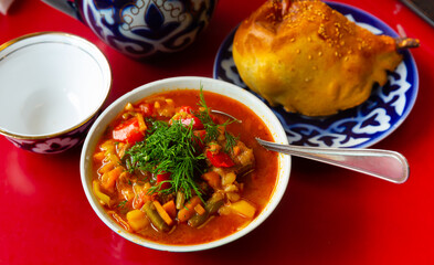 National Central Asian dish is Lagman, which is a thick soup made in a cauldron, made of lamb and vegetables, served with ..noodles
