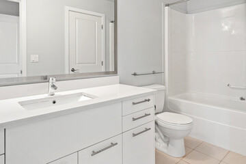 A bathroom with a white toilet and sink