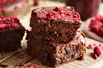 Homemade gluten-free brownies made with red kidney beans, oat flakes, chocolate and freeze-dried...