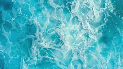 Obraz premium Experience the serene beauty of turquoise foam dancing on the blue ocean, creating a calming water texture.