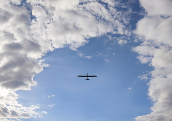 drone flying in the blue sky. military reconnaissance drone