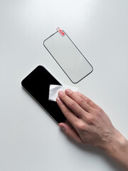 Preparation the screen of the smartphone for installing protective glass