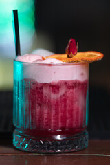 cocktail in a restaurant, professional shooting. a cocktail glass filled with a bright drink, decorated with additional decor. professional photography of a drink